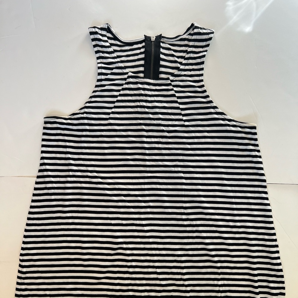 Flowy soft jersey tank top with cute zipper detail in back.